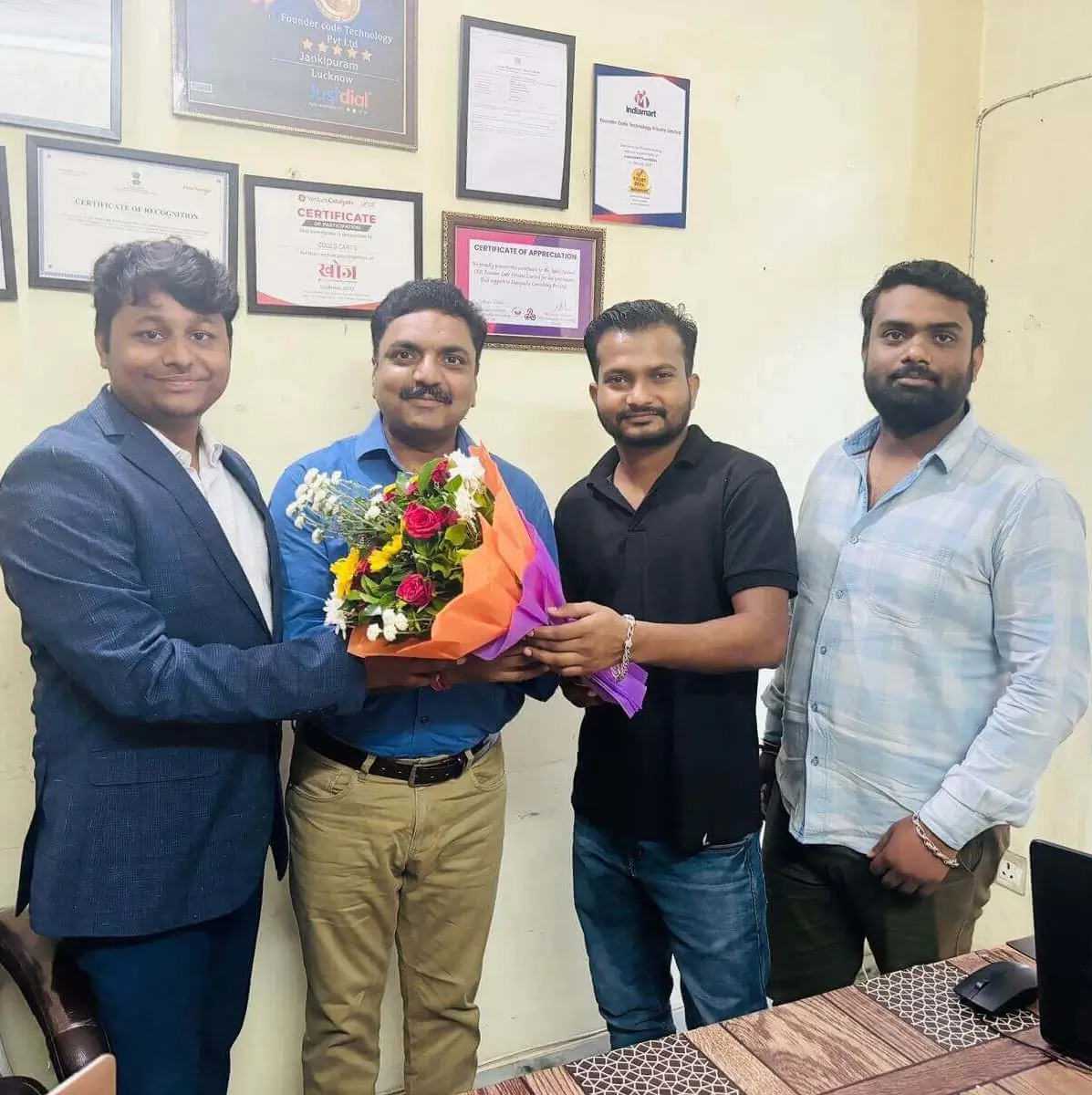 Mentor, Founder, and Co-founder sharing a moment together